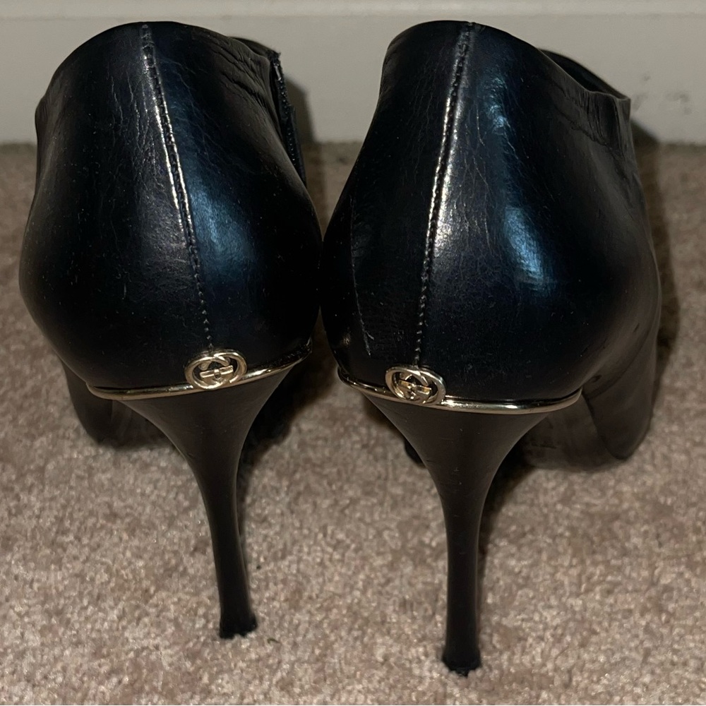 Gucci black booties with Gold hardware